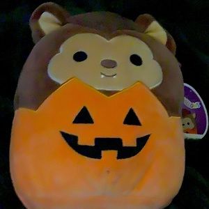 Brown werewolf with orange jack-o’-lantern body